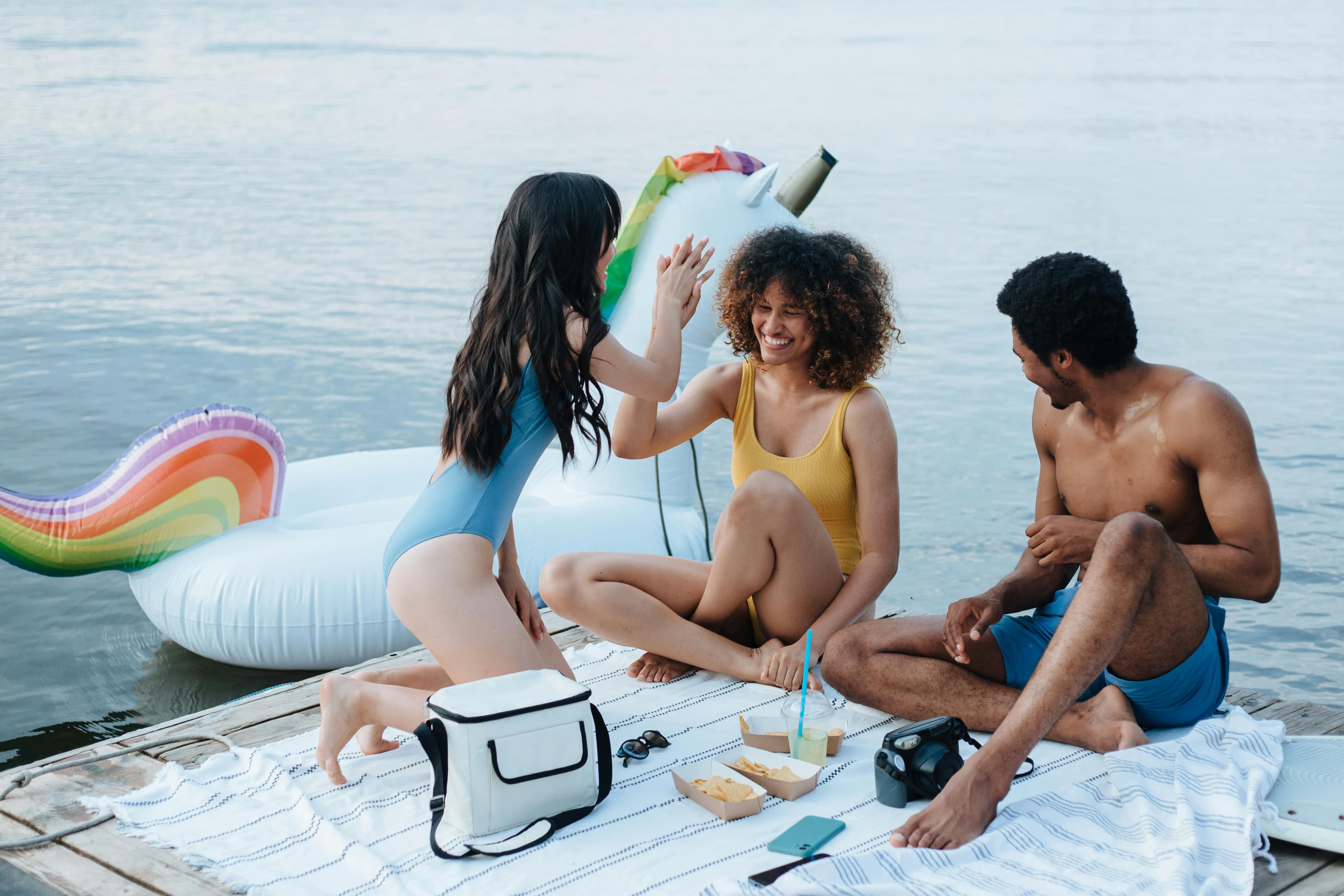 People smiling by the water